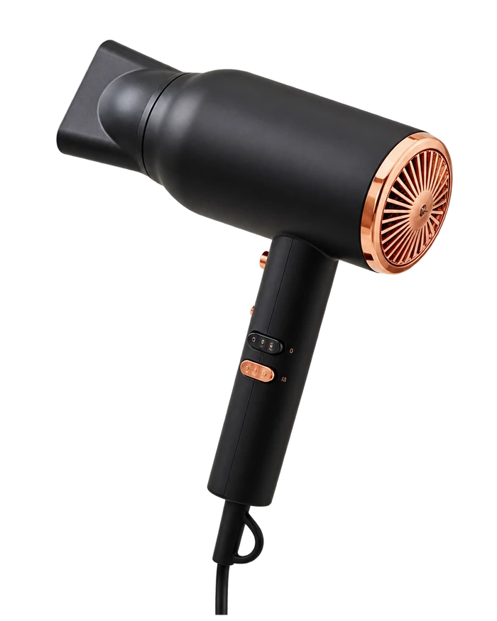 Black hair dryer with copper details, pointing toward the hair video